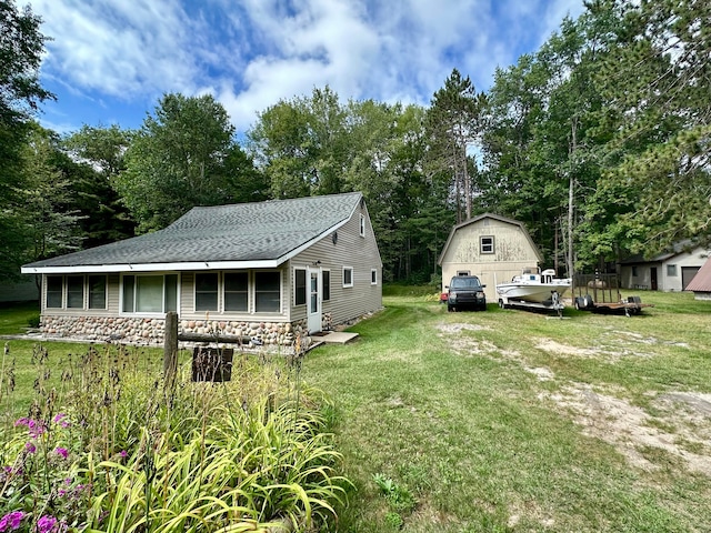 exterior space featuring an outdoor structure and covered porch