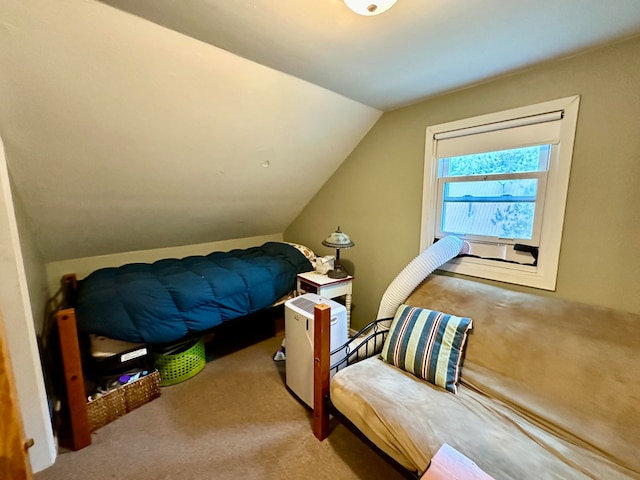 bedroom with lofted ceiling and carpet