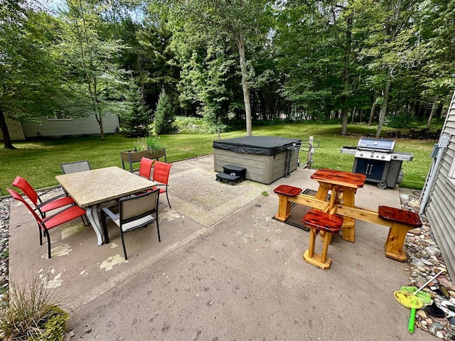 view of patio / terrace featuring a grill and a hot tub