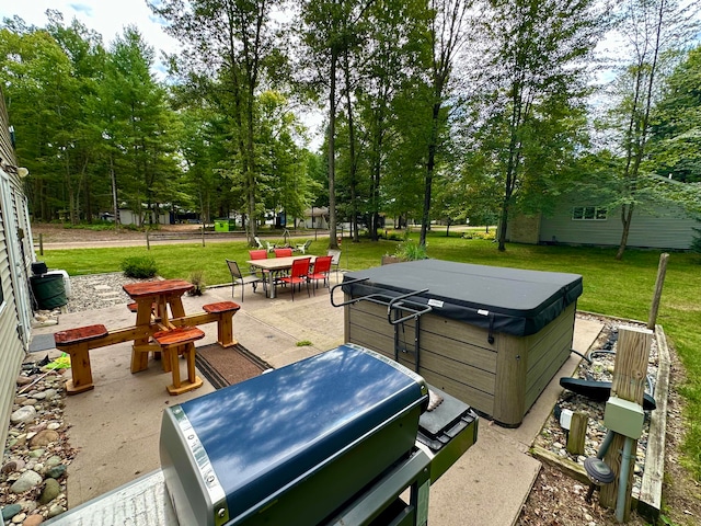 view of patio / terrace with a hot tub