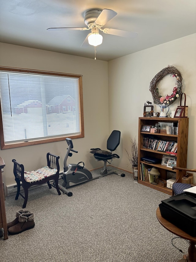 workout room with carpet and ceiling fan