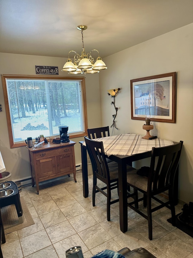 dining room featuring a baseboard radiator and an inviting chandelier