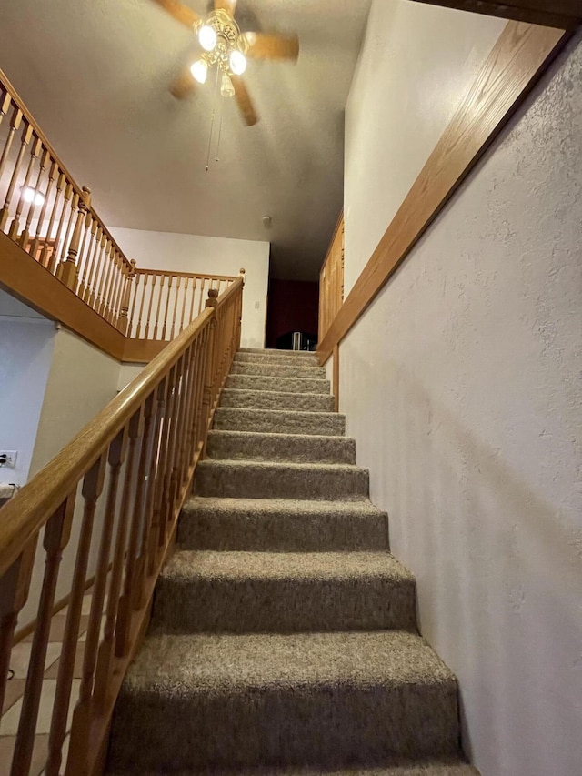 staircase with ceiling fan