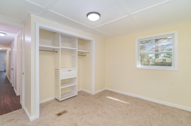 unfurnished bedroom with a closet and wood-type flooring