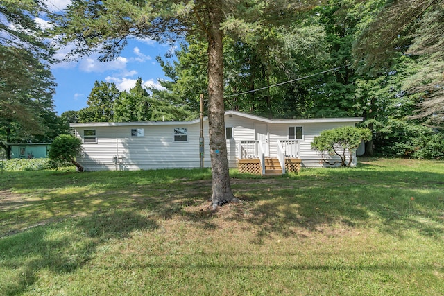 view of yard featuring a wooden deck