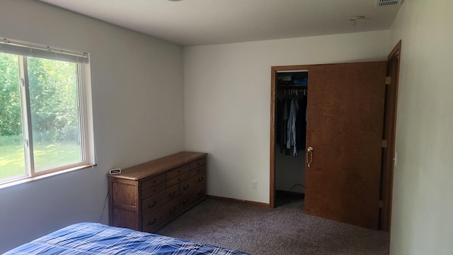 unfurnished bedroom featuring carpet floors and a closet