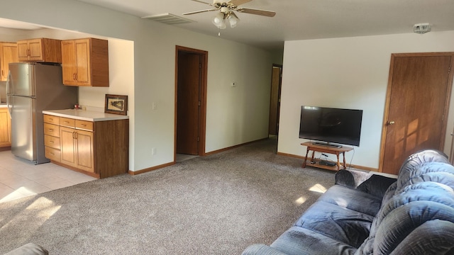 living room with ceiling fan and light carpet