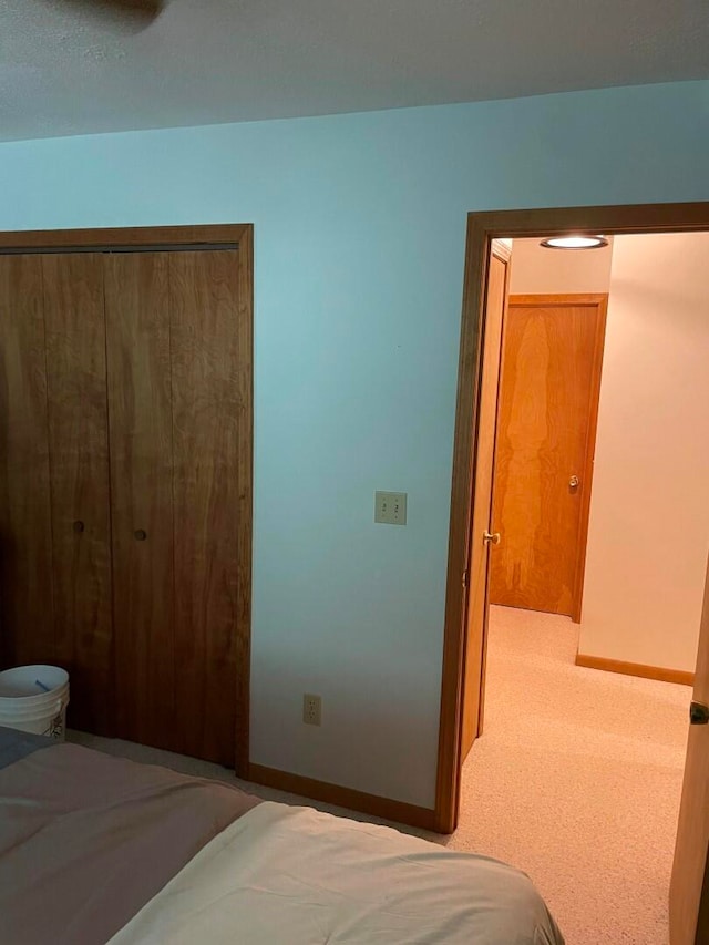 bedroom featuring a closet and carpet floors