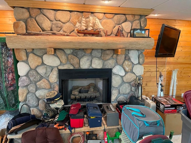 interior details featuring a stone fireplace