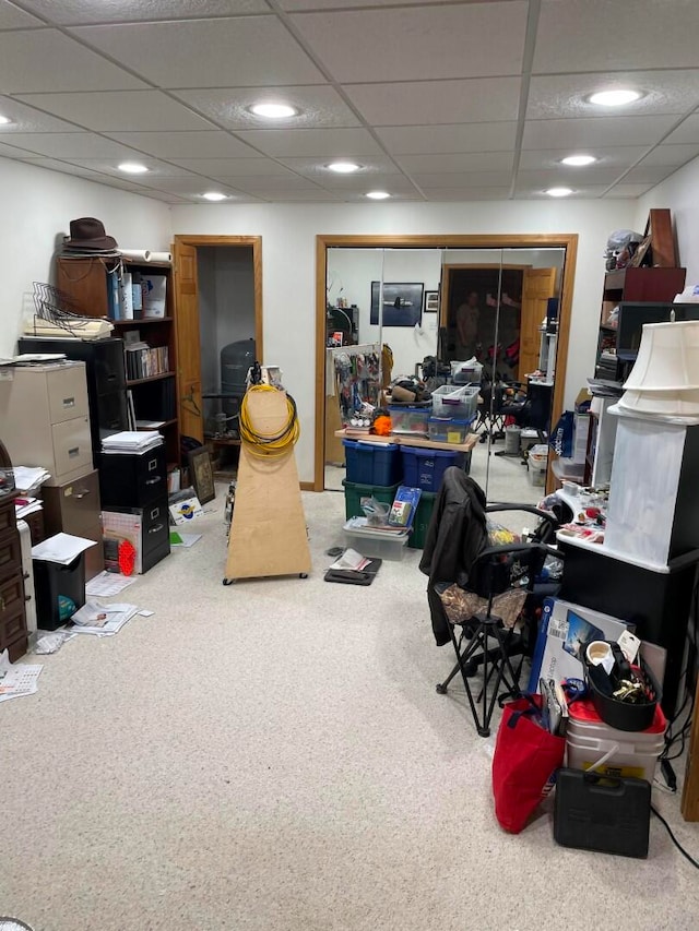 office area featuring carpet floors and a drop ceiling