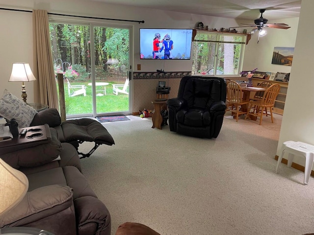 living room with carpet and ceiling fan