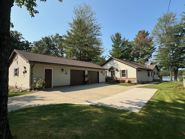 ranch-style home with a garage and a front yard