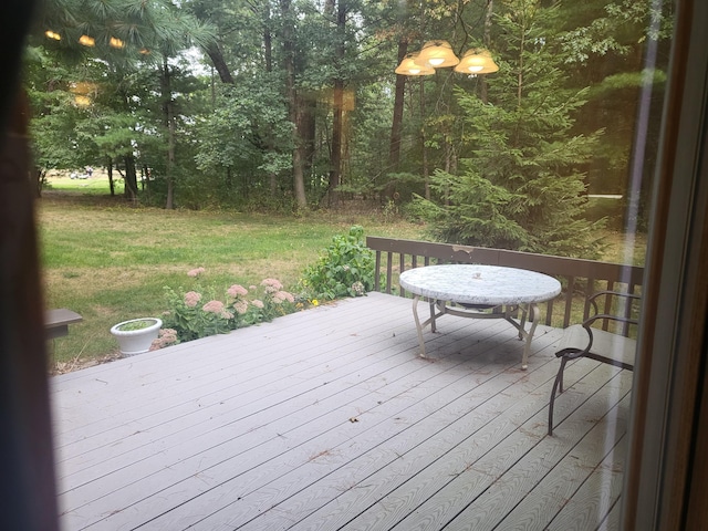 wooden terrace with a yard