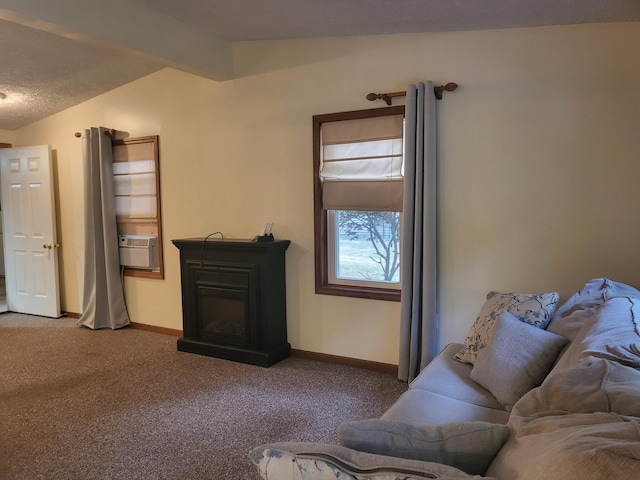 carpeted living room featuring cooling unit and a textured ceiling