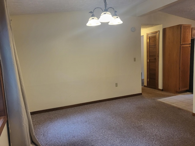 unfurnished room featuring a textured ceiling, a notable chandelier, and light carpet