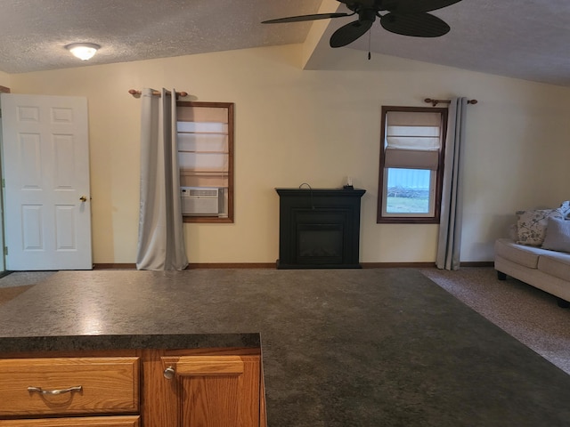 unfurnished living room with carpet, lofted ceiling, cooling unit, ceiling fan, and a textured ceiling