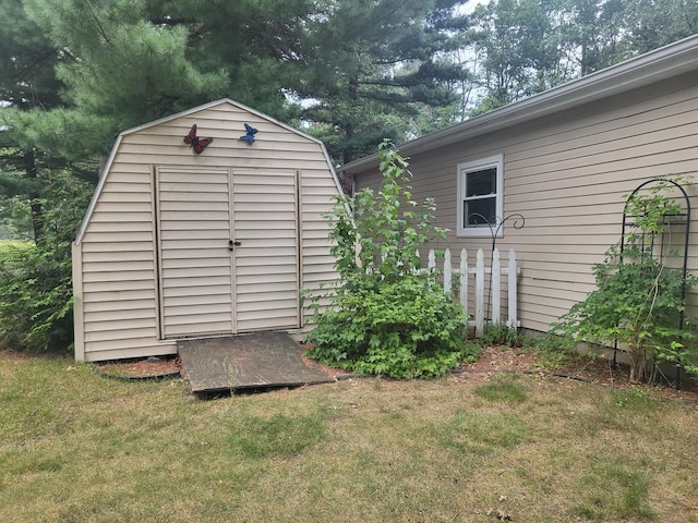 view of outbuilding featuring a yard