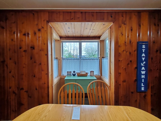 dining space with wooden walls