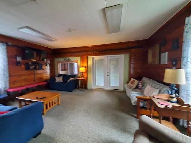 living room featuring wood walls and carpet floors