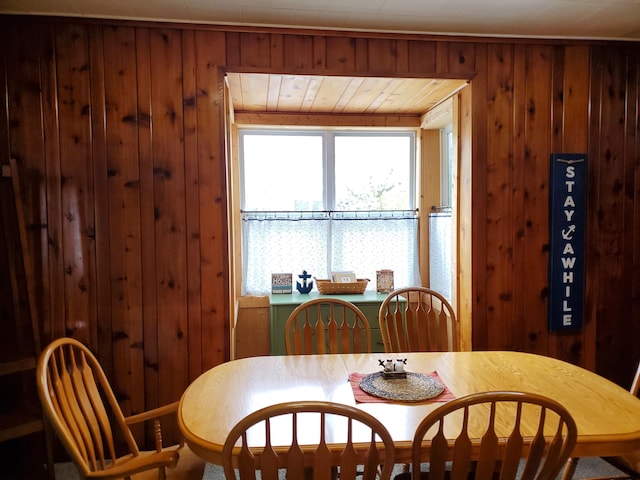 dining area with wood walls