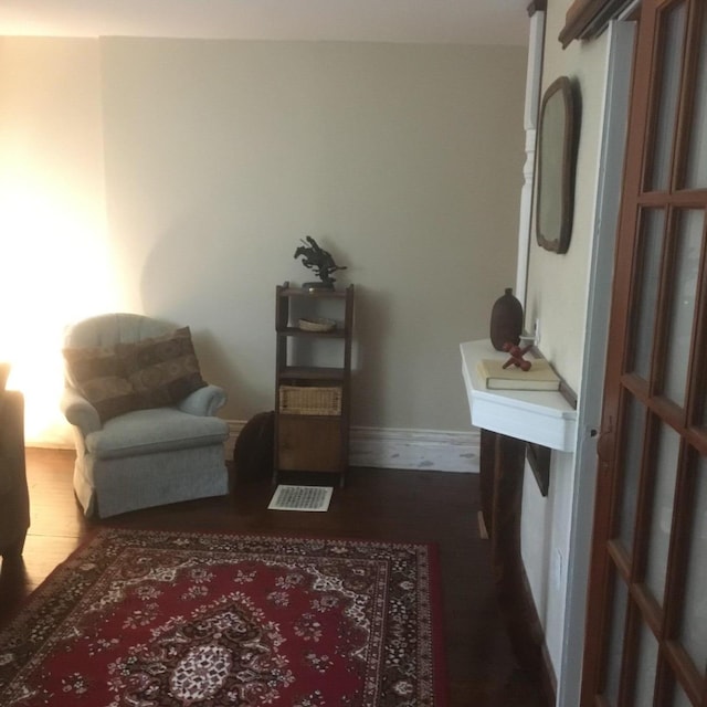 sitting room featuring dark hardwood / wood-style floors