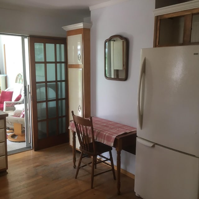 dining room with hardwood / wood-style flooring