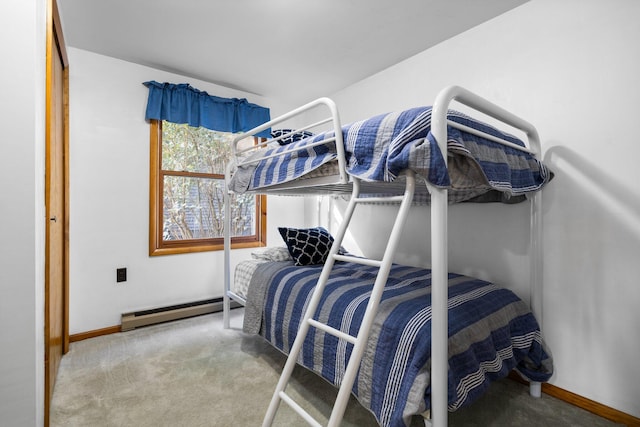 carpeted bedroom with a baseboard radiator