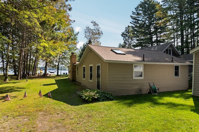 view of property exterior featuring a yard