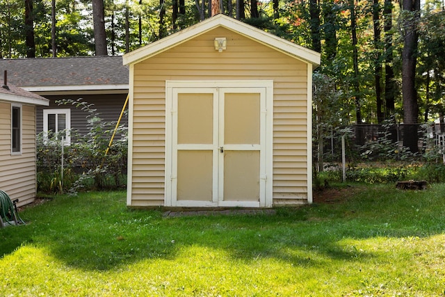 view of outdoor structure with a yard