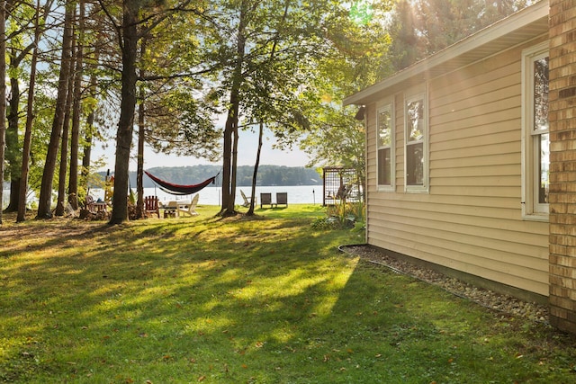 view of yard with a water view