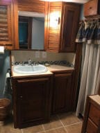 bathroom with tile patterned floors and sink