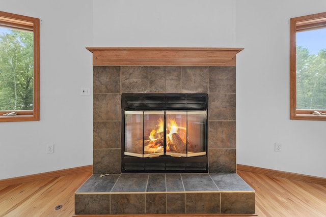 interior details with a fireplace and hardwood / wood-style flooring