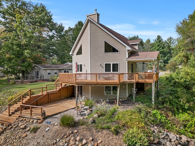 rear view of property with a wooden deck