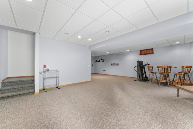 basement featuring a paneled ceiling