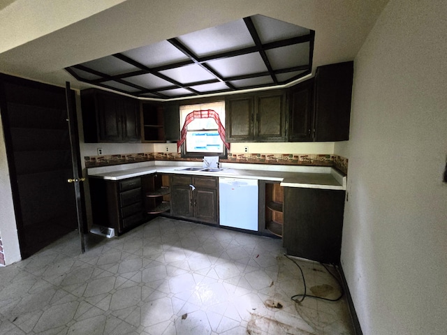 kitchen featuring dishwasher, dark brown cabinetry, and sink