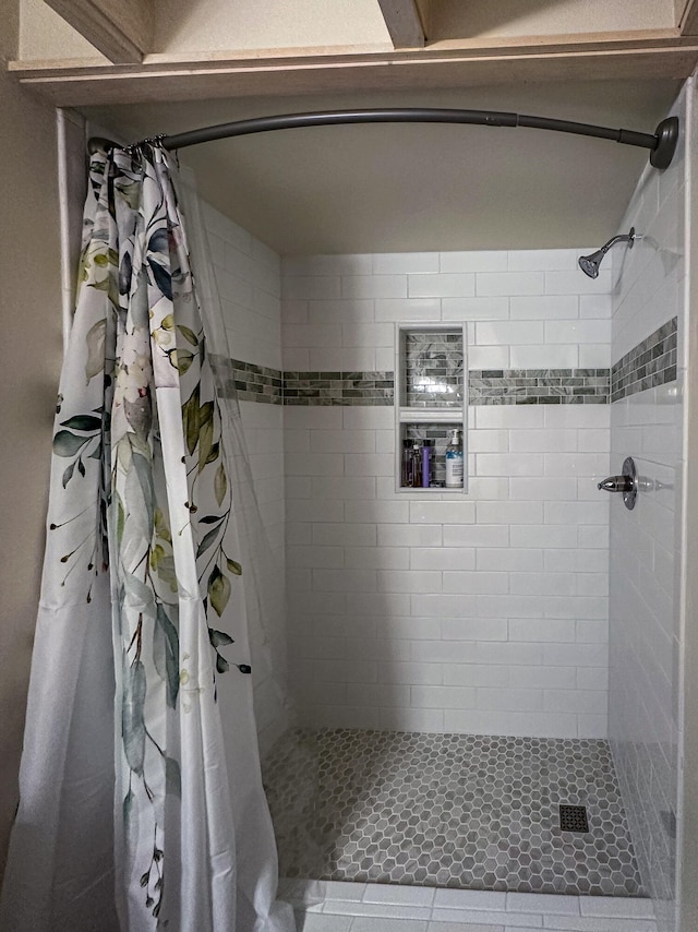 bathroom with curtained shower