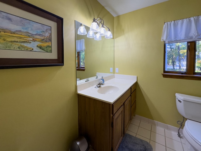 bathroom with tile patterned flooring, vanity, and toilet