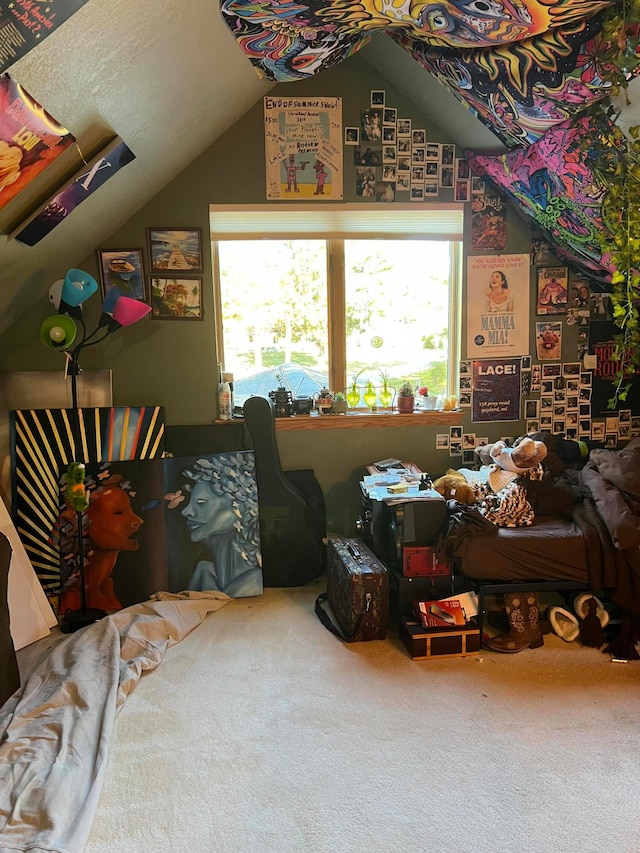 interior space featuring lofted ceiling and carpet floors