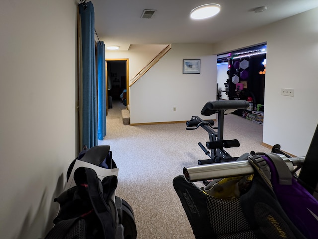 workout area featuring carpet flooring