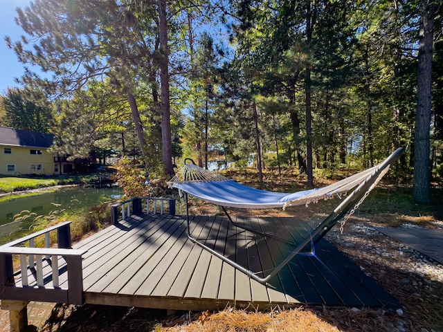 wooden deck with a water view