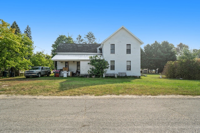 view of property featuring a front yard