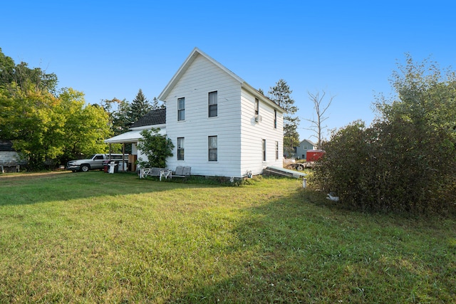 view of property exterior featuring a lawn