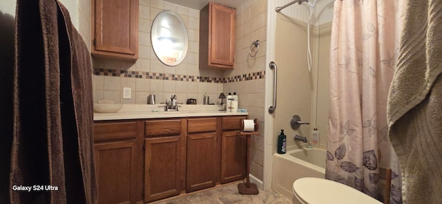 full bathroom featuring vanity, toilet, shower / bath combination with curtain, and tile walls