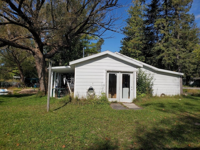 view of outdoor structure with a lawn