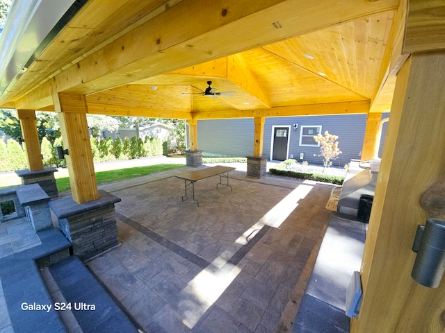 view of patio featuring ceiling fan and a gazebo