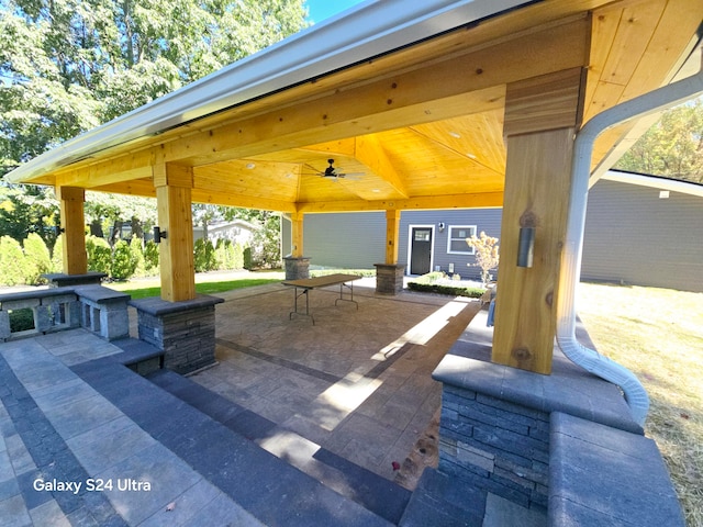 view of patio with ceiling fan and a gazebo