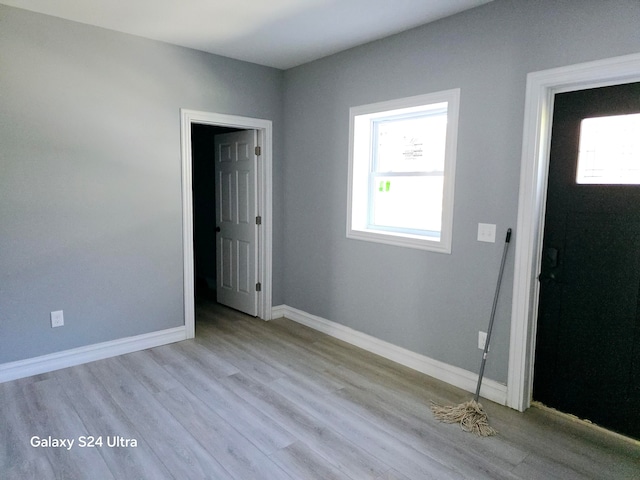 unfurnished room with light hardwood / wood-style flooring