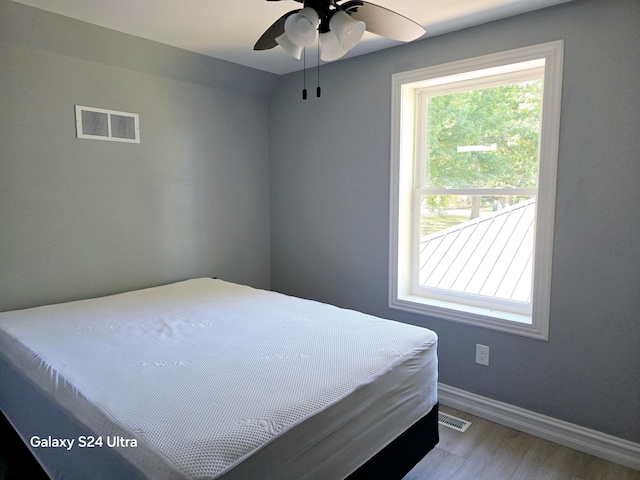 bedroom featuring wood-type flooring and ceiling fan