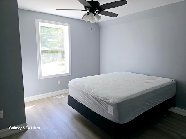 bedroom featuring ceiling fan and light hardwood / wood-style flooring