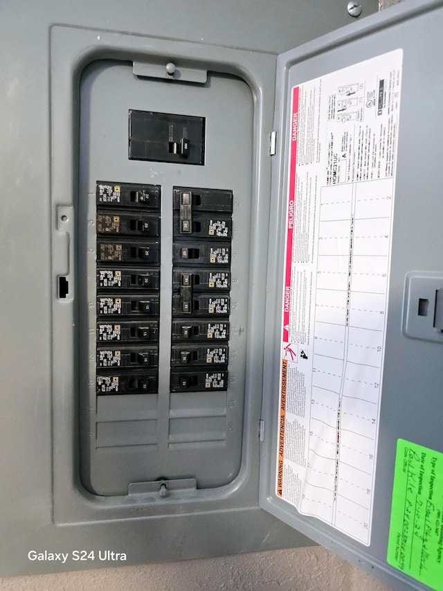 utility room featuring electric panel